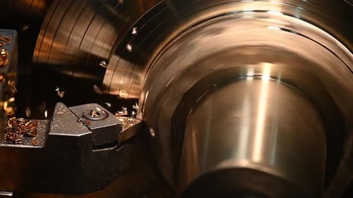 Metal Cylinder Rotates on a Lathe Machine