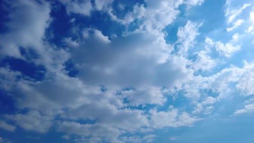 White Clouds Float in a Deep Blue Sky