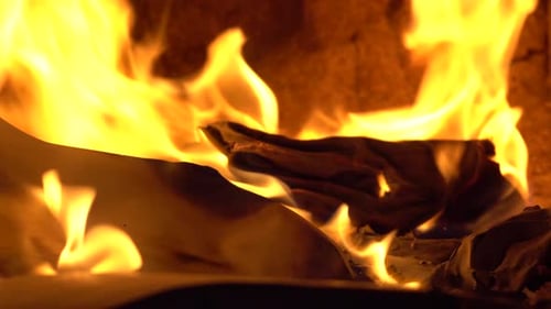 Flames Consuming Paper in Fire