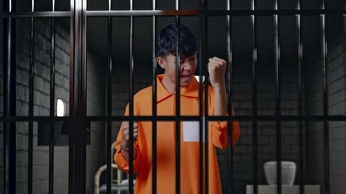 Prisoner With Broken Handcuffs Screaming Goal Celebrating In Prison