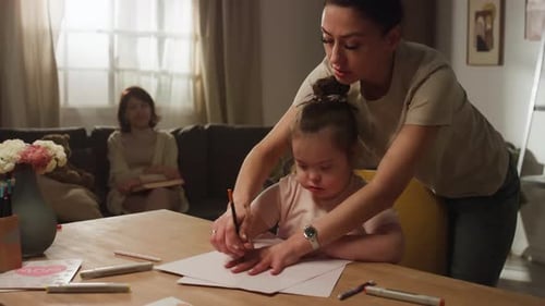 Child Drawing with Adult at Home