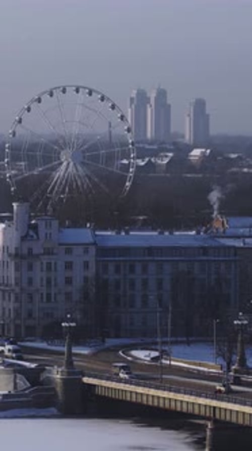 Aerial Riga Winter Panorama with Ferris Wheel Bridge and River