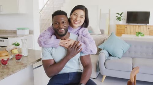 Happy Couple Smiling Together in Modern Home