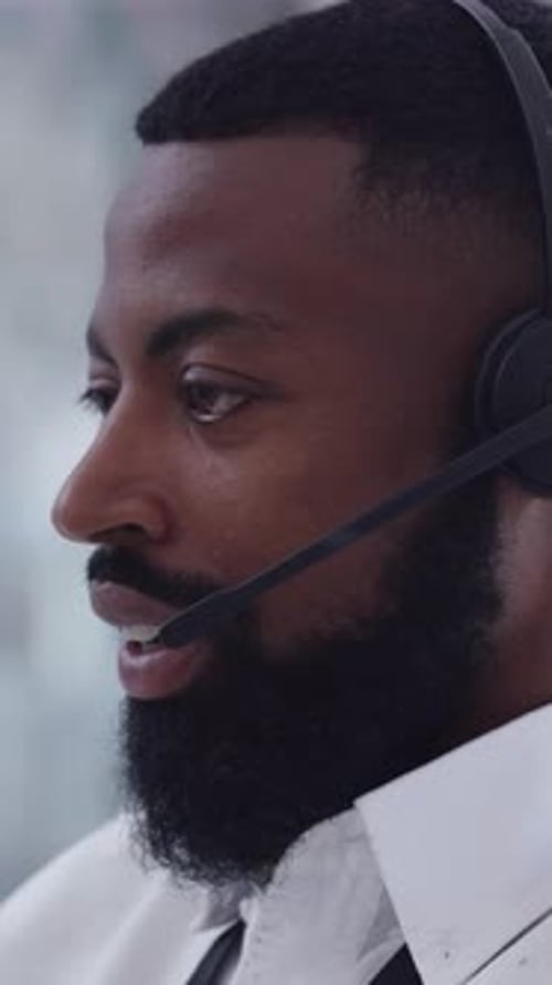 Call center, help and black man in office with headset, contact us and assistance in crm service