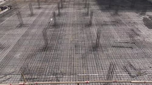 Aerial View Workers on Construction Site Preparing Foundation and Bending Metal Rebar