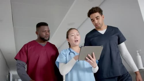 Medical professionals in a hospital corridor, with copy space