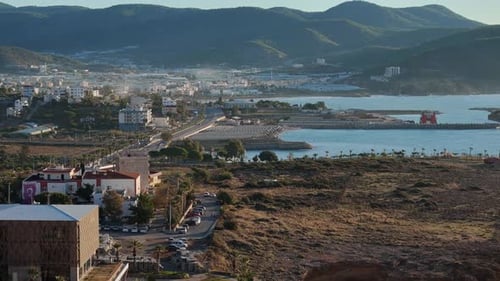 Aerial View of Turkish Coastal City with Harbor and Mountains