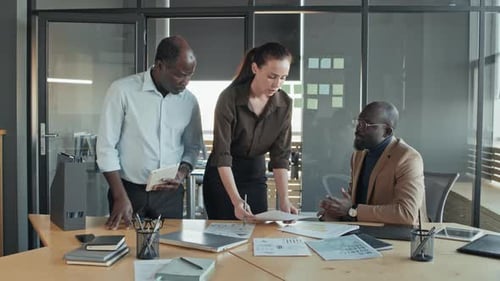 Multiethnic Business Team Discussing Project in Office