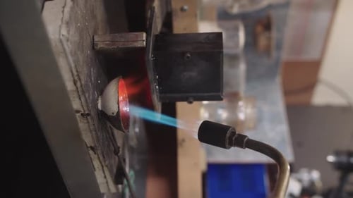 Torch with Blue Flame Aimed at Round Piece