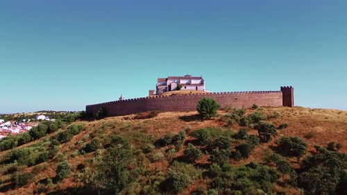 Stone Battlement Wrapping Monastery in Ancient Town Fortified Wall