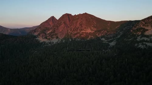 Aerial View of a Picturesque Mountain Peak Illuminated By the Setting Sun and Surrounded By Dense