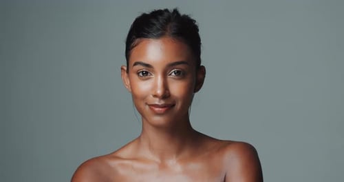 Woman, studio background and portrait with smile for beauty or skincare, confident and clean