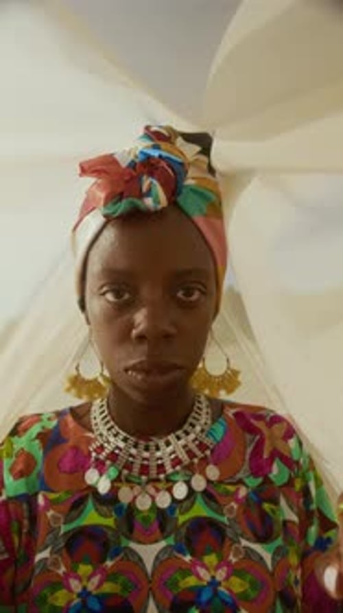 Young Black Woman in Ethnic Clothes under Veil