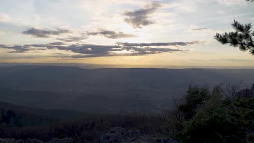 Mountain view of sun setting stock