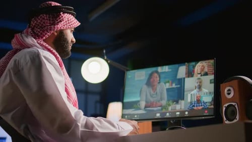 Man Talking in Video Conference in an Office