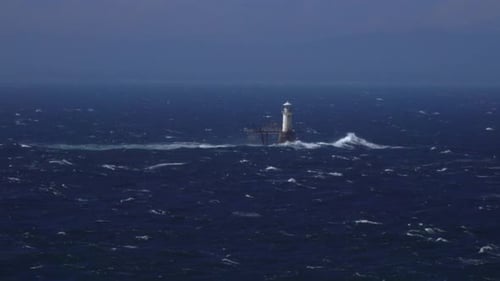 Lighthouse in Ocean on a Stormy Day
