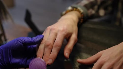 Closeup Cleaning Male Nails with Brush in Slow Motion in Beauty Salon High Angle View Closeup