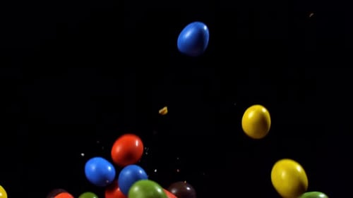 Colorful Candy Pieces Floating on Black Background