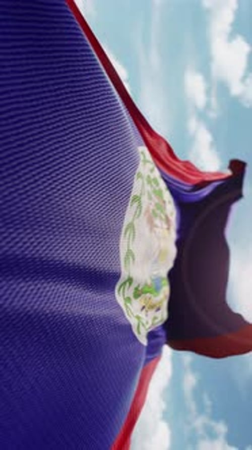 Belize National Flag Waving Realistically with Blue Sky Background
