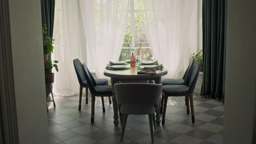 Elegant Dining Room with Table Setting and Chairs