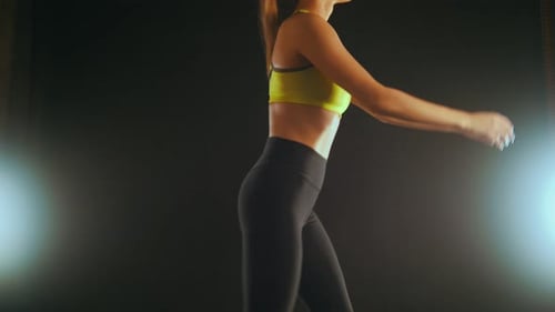 Young Woman in the Fitness Studio Doing Exercises for Body