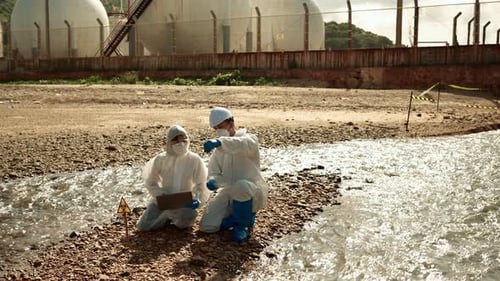 Researchers Examine a Stream Near an Industrial Zone