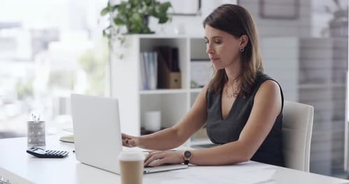 4k video footage of a young businesswoman throwing her laptop angrily in an office at work