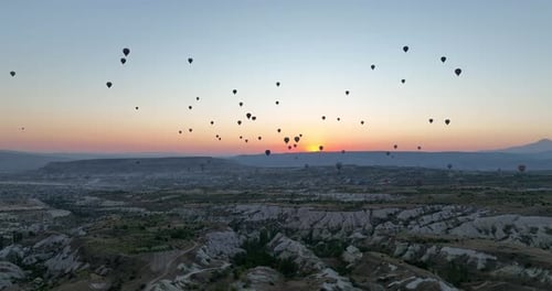 Aerial Cinematic Drone View of Colorful Hot Air Balloon Flying Over Cappadocia