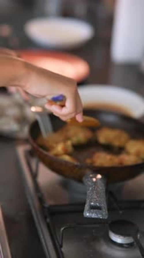 Frying Food in a Pan at Home