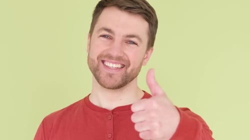 Smiling Man Gives Thumbs Up Approval