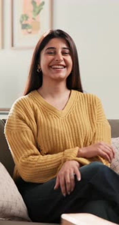 Real estate, face and woman on couch with pride, fresh start and investment in dream house