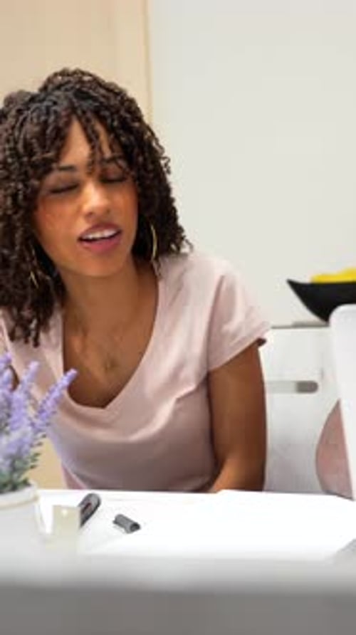 Young Adults Discussing a Laptop Project Indoors