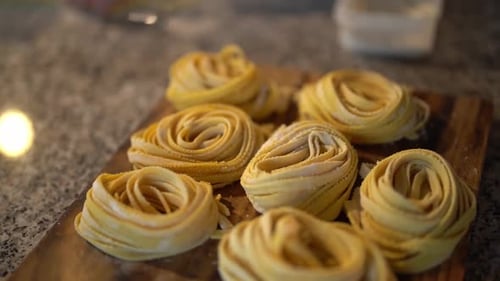 Noodle Rolls on Wooden Cutting Board in Restaurant
