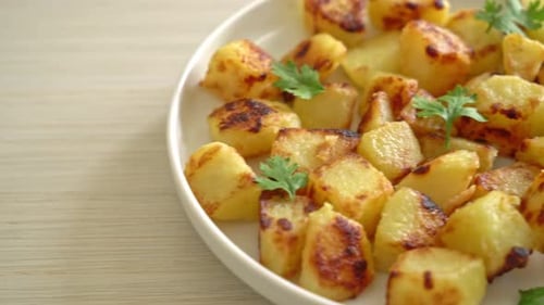 Golden Fried Potatoes Served on Plate