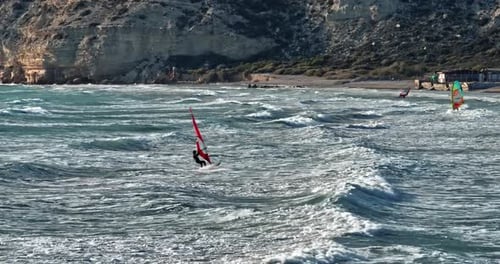 Aerial of Windsurfing Dynamic Sea Sports with Sailboard Floating on Waves