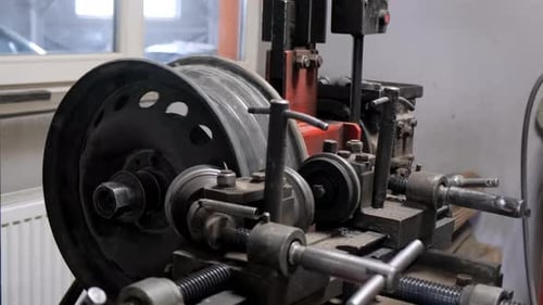 Machine Working on Automotive Tire in Garage for Motor Vehicle