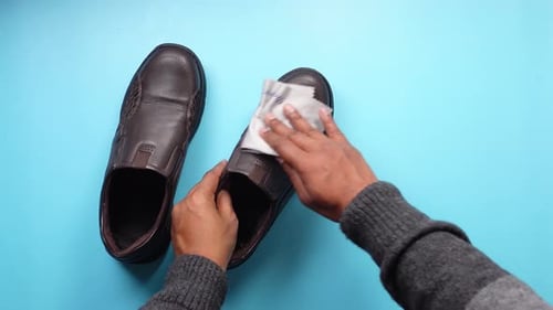 Man Cleans Brown Leather Dress Shoe Man Cleans Brown Leather Dress Shoe