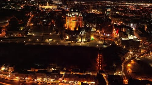 Panoramic View On Old Quebec Illuminated At Nighttime In Quebec City, Canada - aerial drone shot