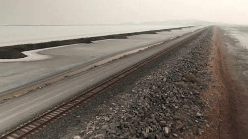LATERAL PANNING OF AWESOME RAILWAY CROSSING THE GREAT SALT LAKE IN UTAH