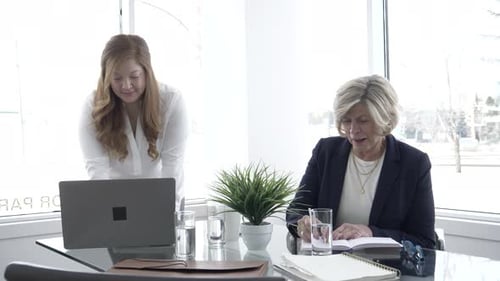 Women Collaborating in Modern Office 70s