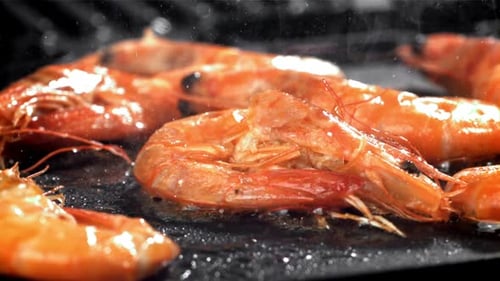 The Shrimp is Fried in a Pan with a Splash Filmed on a Highspeed Camera at 1000 Fps