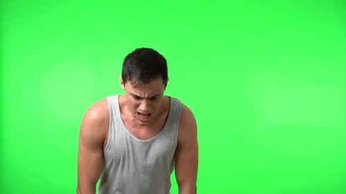 Man Experiencing Pain on Green Screen