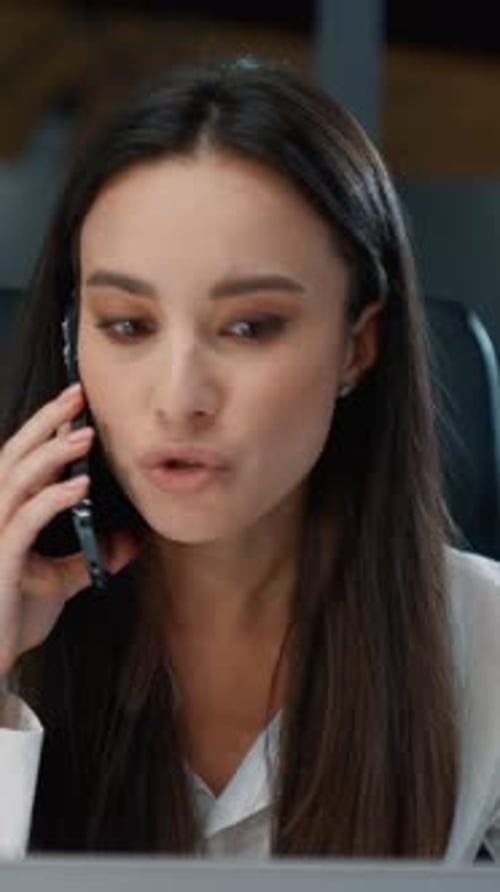 Angry Furious Caucasian Business Woman Talking Arguing Mobile Phone Call Looking in Laptop in Office