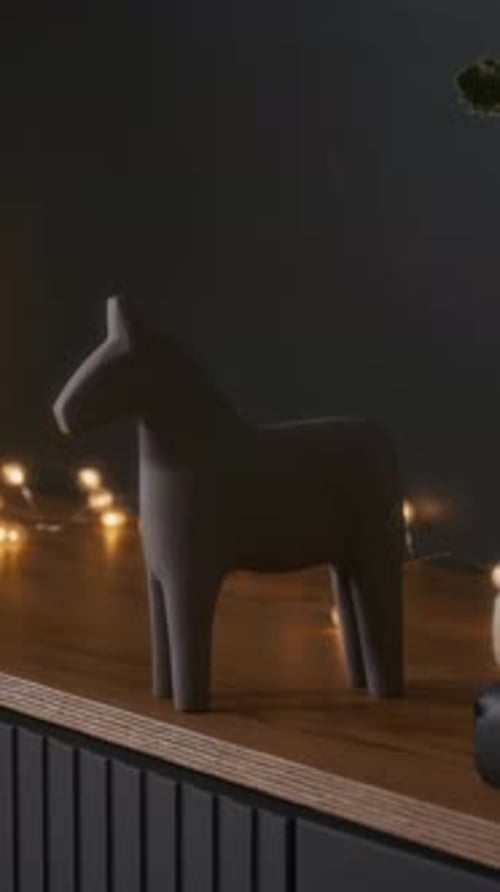 Minimalist Horse Figurine on Wooden Shelf at Home