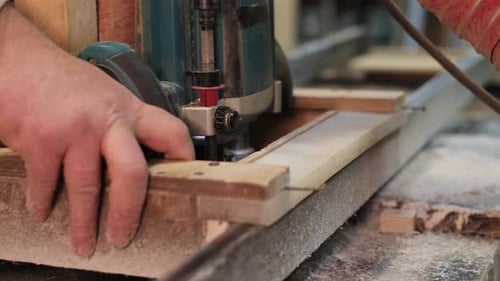 Woodworking Machine Cutting Wood in Workshop