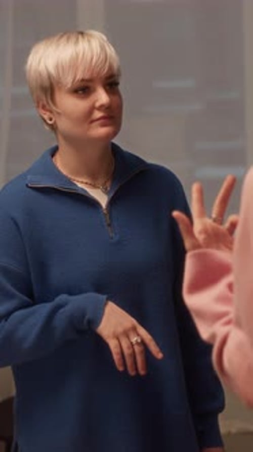 Woman Gesturing and Speaking Indoors