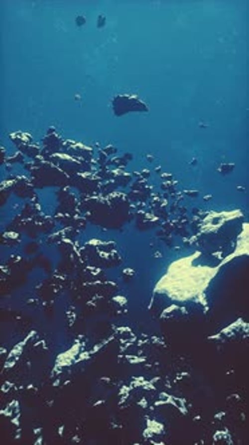 Abstract Floating Debris in Deep Blue Background