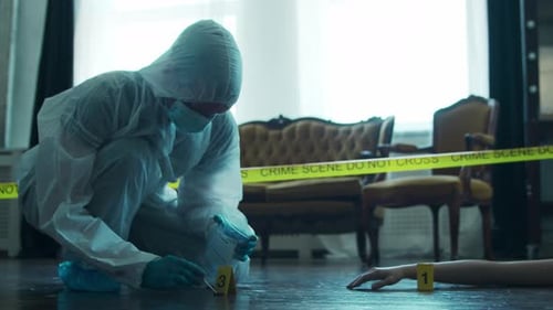 Crime Scene Investigator Collecting Evidence Sample