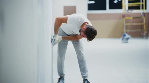 Man Applying Plaster to Wall