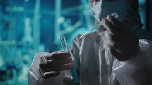 Scientist Works with Chemical Liquid in Laboratory